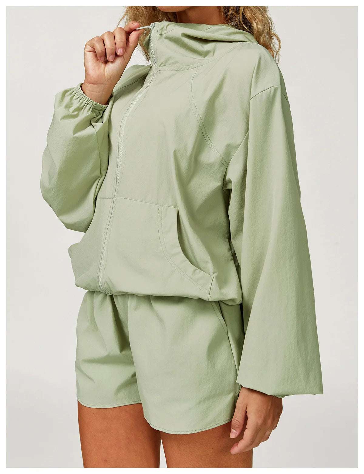 Long sleeved zipper front pocket sports jacket