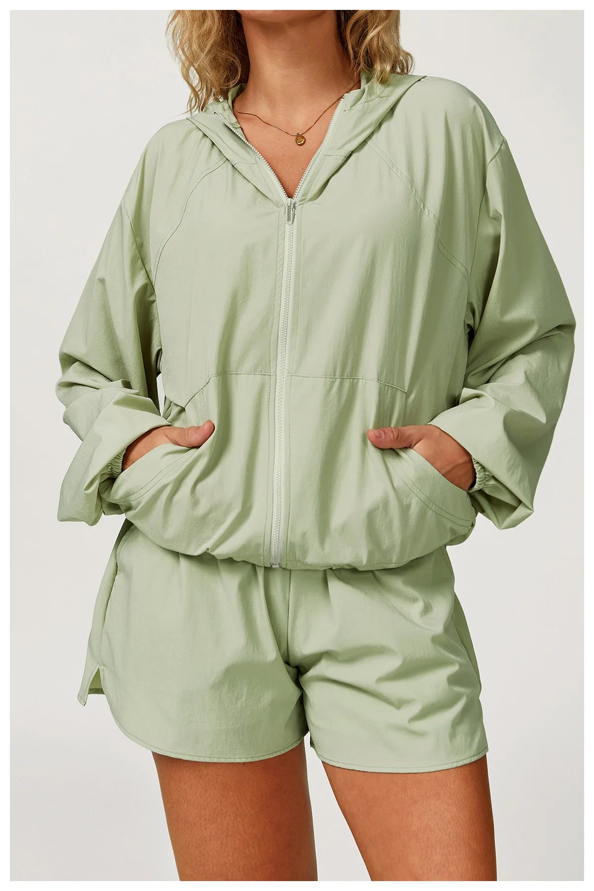 Long sleeved zipper front pocket sports jacket