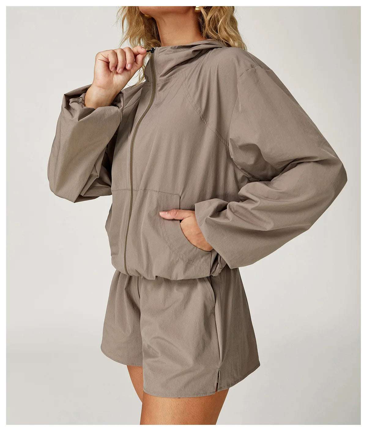 Long sleeved zipper front pocket sports jacket