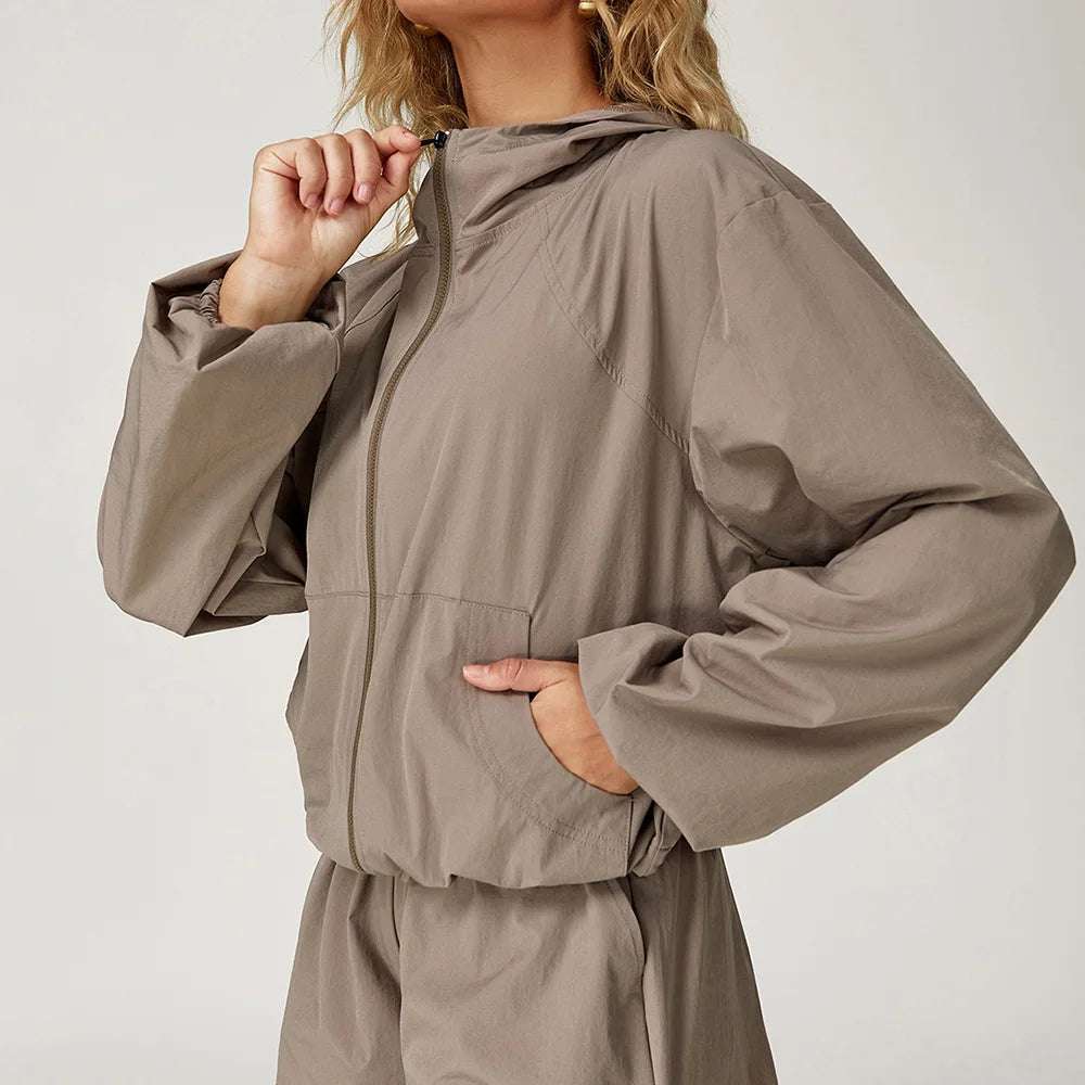 Long sleeved zipper front pocket sports jacket